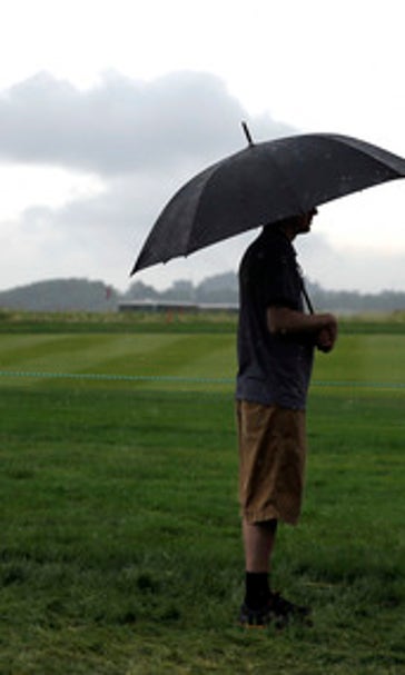 The Latest: USGA 'no-talk' policy tested during rain delay